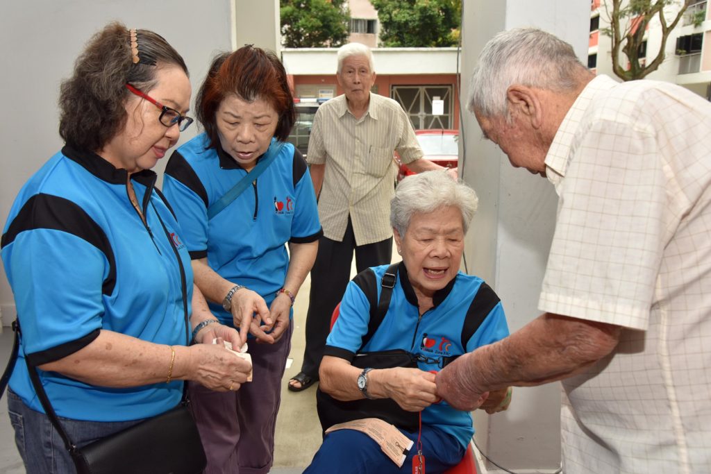 Mdm Tan helping out at the Yuhua Zone 3 RC Block Party